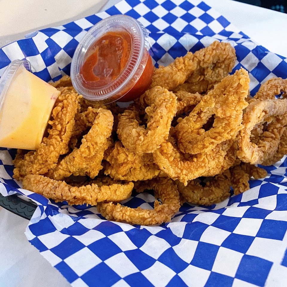 Seafood restaurant menu with Cajun-style selections.